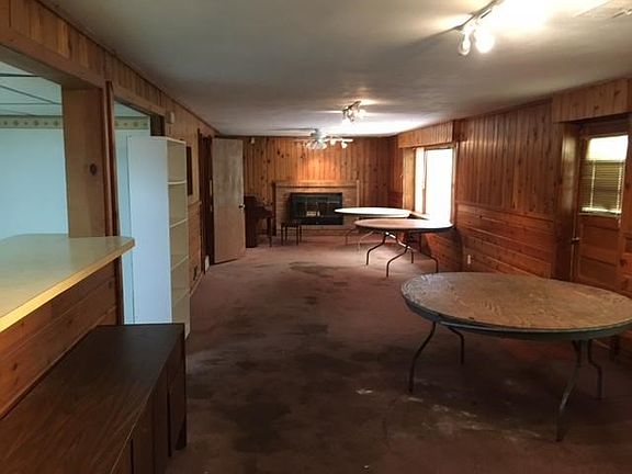 Lower level family room has bar, full kitchen and fireplace.
