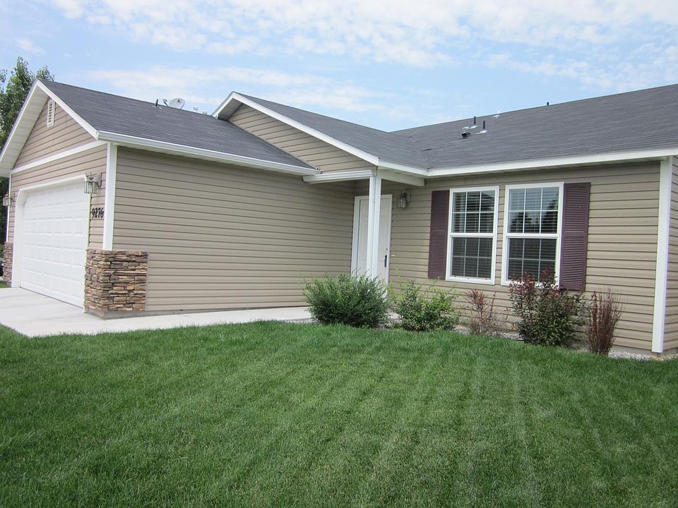Front of house and 2 car garage with key code entry