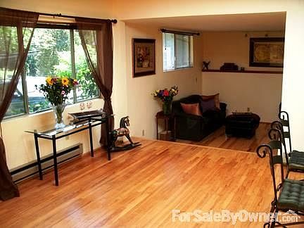 Entryway and sunken living room with fireplace