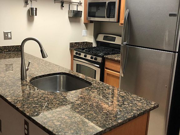 Kitchen with stainless steel appliances and brand new refrigerator!