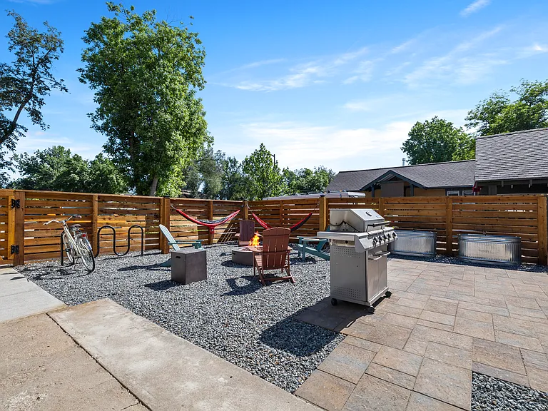 Additional iew of private fenced in patio with BBQ and bike rack