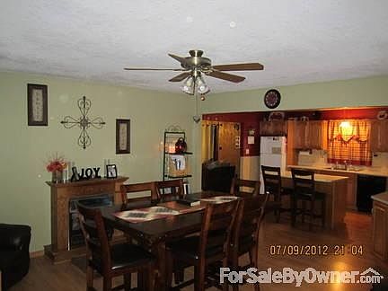 Dining Room-Kitchen
						:
						Large, open concept dining room/kitchen with fire place