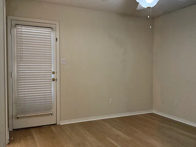 Bedroom #2 with back door entry to deck.