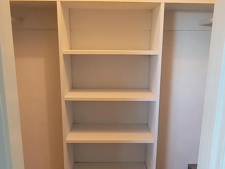 Guest room closet. Small walk- in