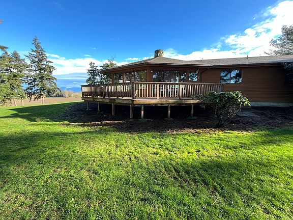 Back of house with deck.