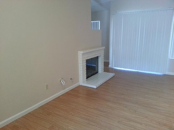 Fireplace and sliding door to backyard