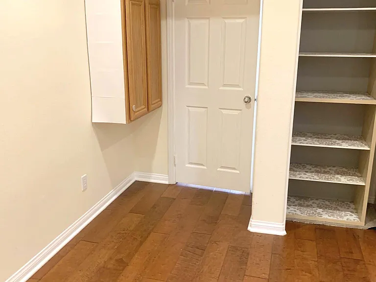 Bedroom #2 (First floor). View from far end of room. Comes with abundant storage