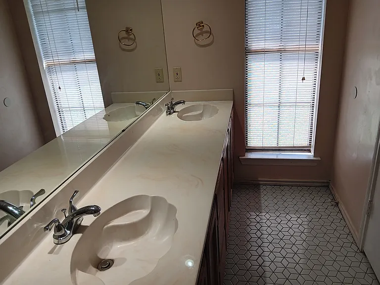 Master bathroom with double(his/her) sinks, full tile shower, separate porcelain tub w/overhead shower feature, private hight seating throne toilet & lighted walk-in closet with shelving.