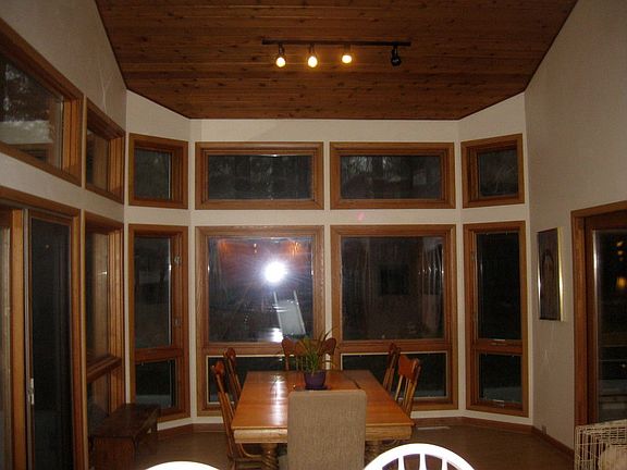 Night view of dining room from kitchen : Favorite room in the house! It's so sunny during the day.