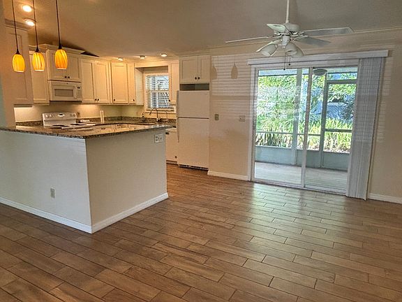 Kitchen, Dining Area, Screened Porch and Backyard