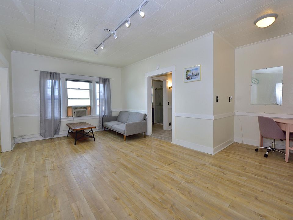 updated LARGE studio with many windows, furnished with in-unit laundry machines