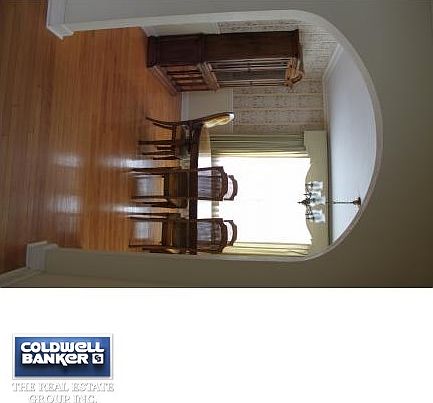 Gleaming hardwood/arched doors