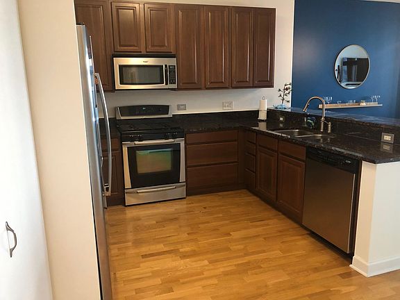 Open Kitchen with new Stainless Steel Appliances and Granite Countertops