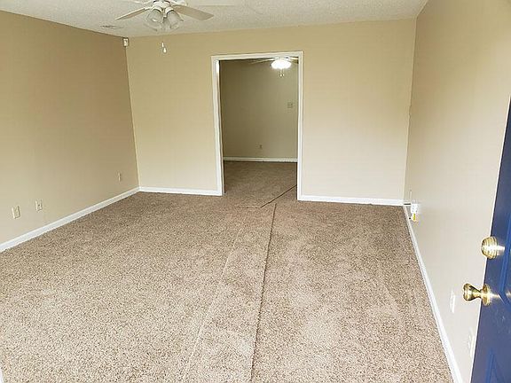 Looking in from front door. Living room leads into Dining