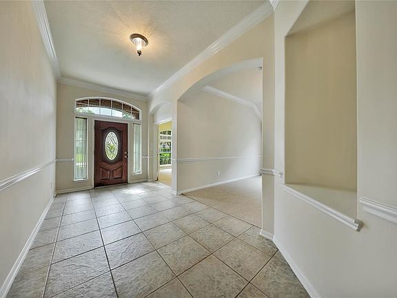 Spacious entryway and impressive front door w/etched glass.