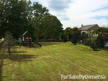 Swimming pool
						:
						Professionally landscaped yard with sprinkler system