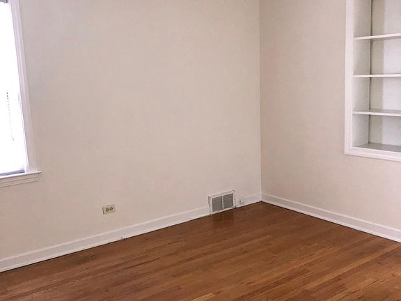 Master bedroom with closet and built in shelves. Attached Sunroom/Office with brand new flooring