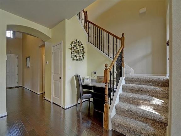 Gleaming hardwoods accent the downstairs.  This nice built-in desk area is a great place for home management tasks or the perfect spot for guided homework.