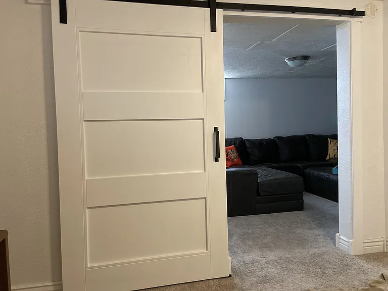 Barn door between family room & office in basement