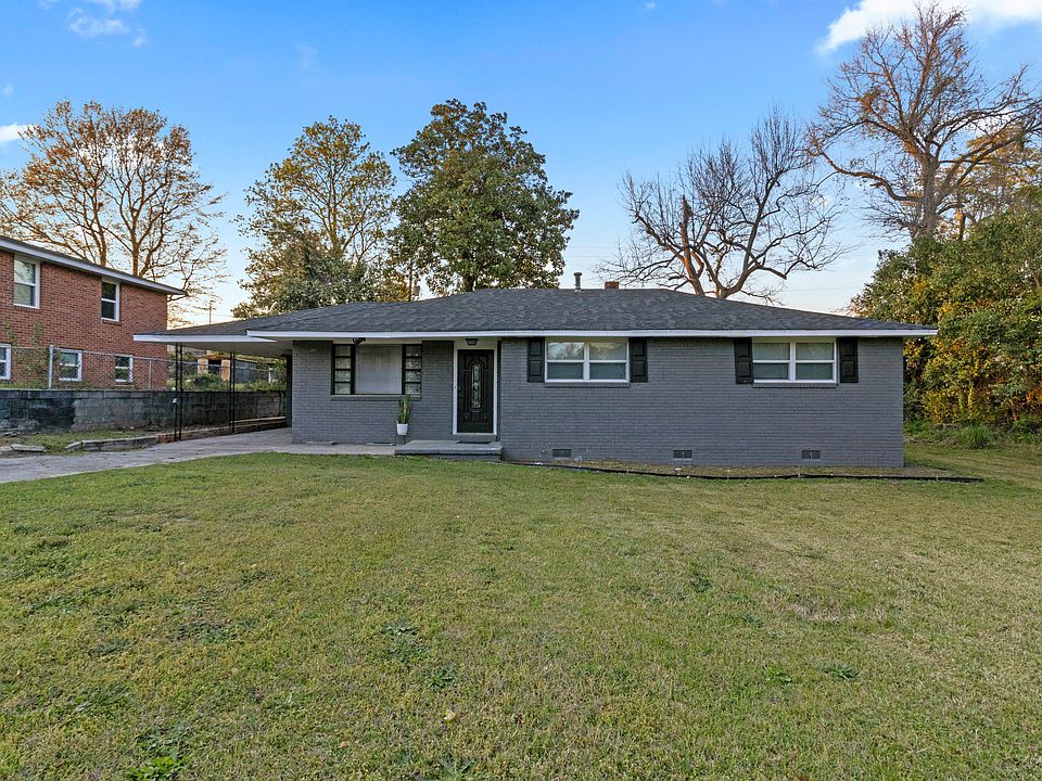 The charming front entrance and well-kept landscaping provide a warm welcome.