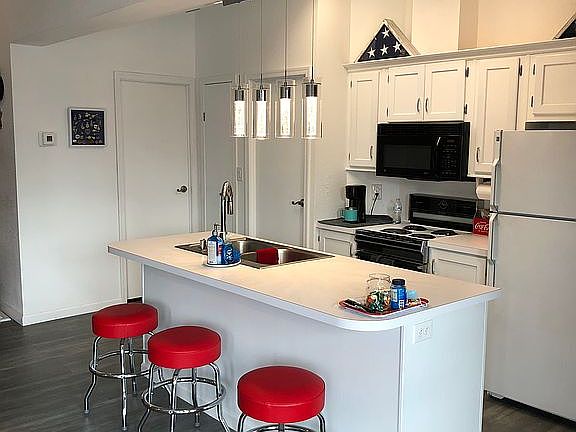 Kitchen with island and bar