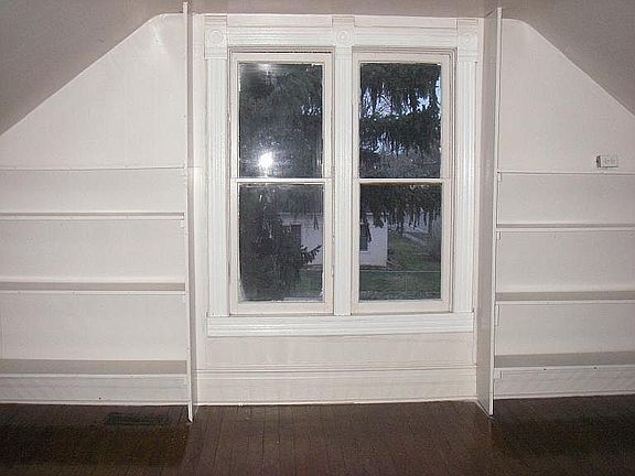 Upstairs bedroom built-in shelving and new window