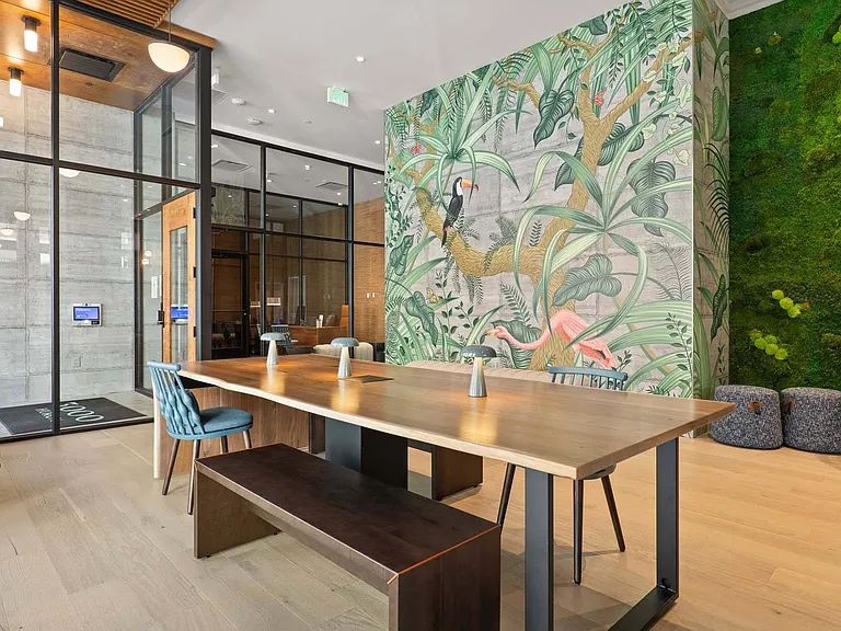 Gather around a long table in the lounge, designed for both style and functionality.