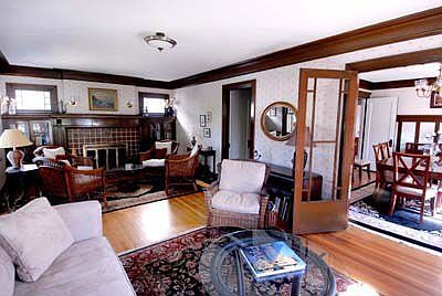 LR - beautiful original woodwork and Fireplace bookcases