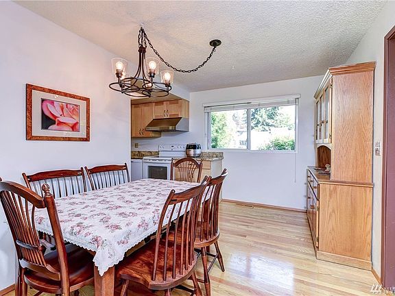 Kitchen Eating Space with room for full size dining table, with room for your hutch.  Updated chandelier.  