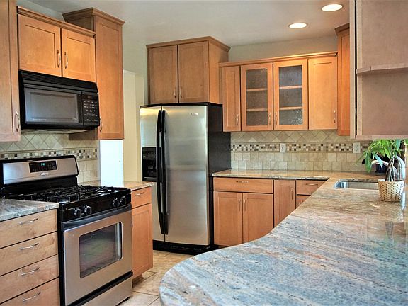 Beautiful kitchen includes granite countertops, stainless steel appliances with whisper quiet Bosch dishwasher and plenty of storage!