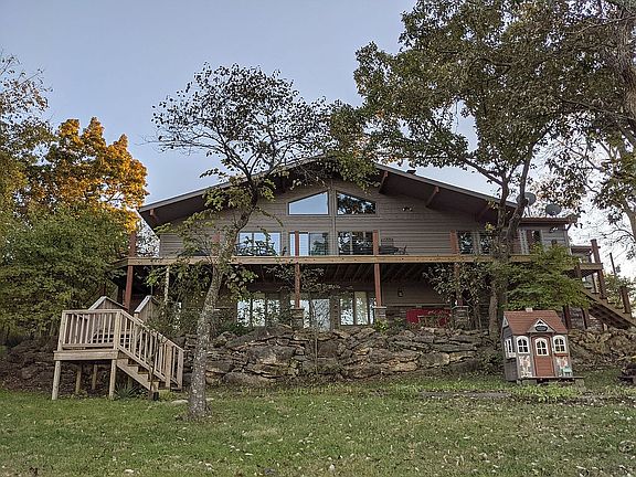 Backside faces N toward lake