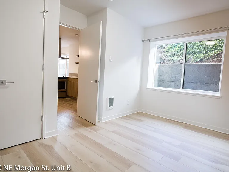 Bedroom with large window and privacy