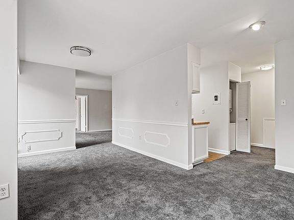 Breakfast/Dining area looking to kitchen and formal dining/sitting area.