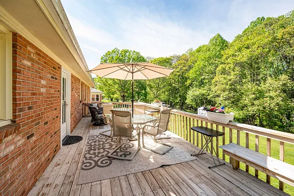 Deck overlooks woods at the edge of the yard - 400 College Park Dr