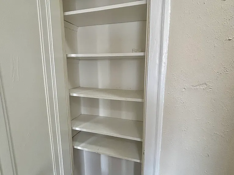 linen closet outside larger bathroom