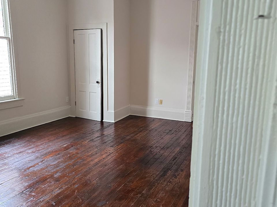 Bedroom with original fireplace with a private closet.