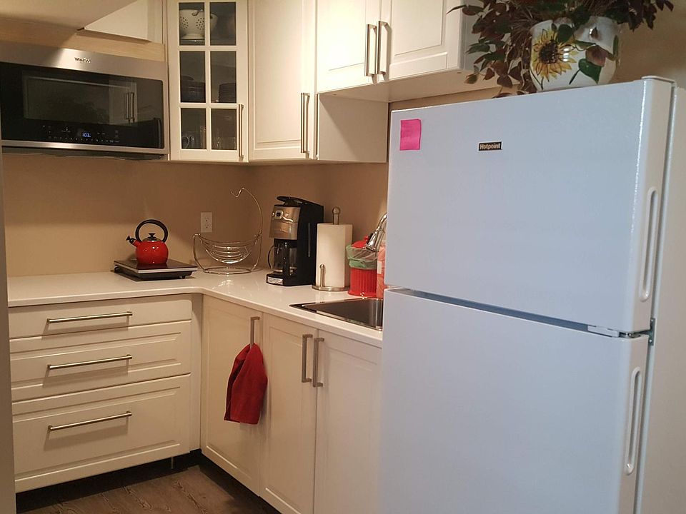 The kitchenette with convection microwave oven, full-size fridge, and garbage disposal. Two hotplates provided for cooking.