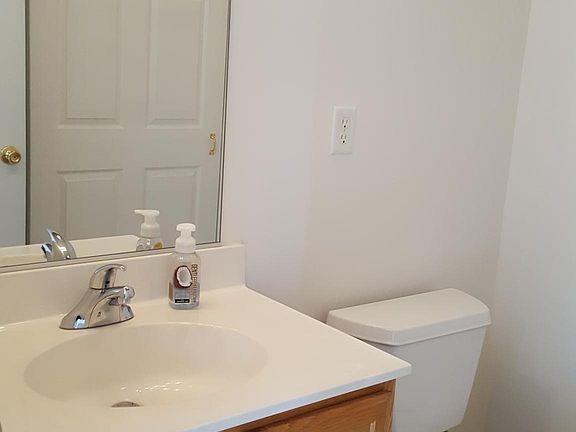 Half Bath off kitchen includes washer/dryer unit
