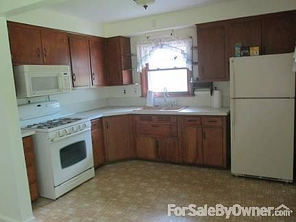 Refrigerator, gas range and microwave included.