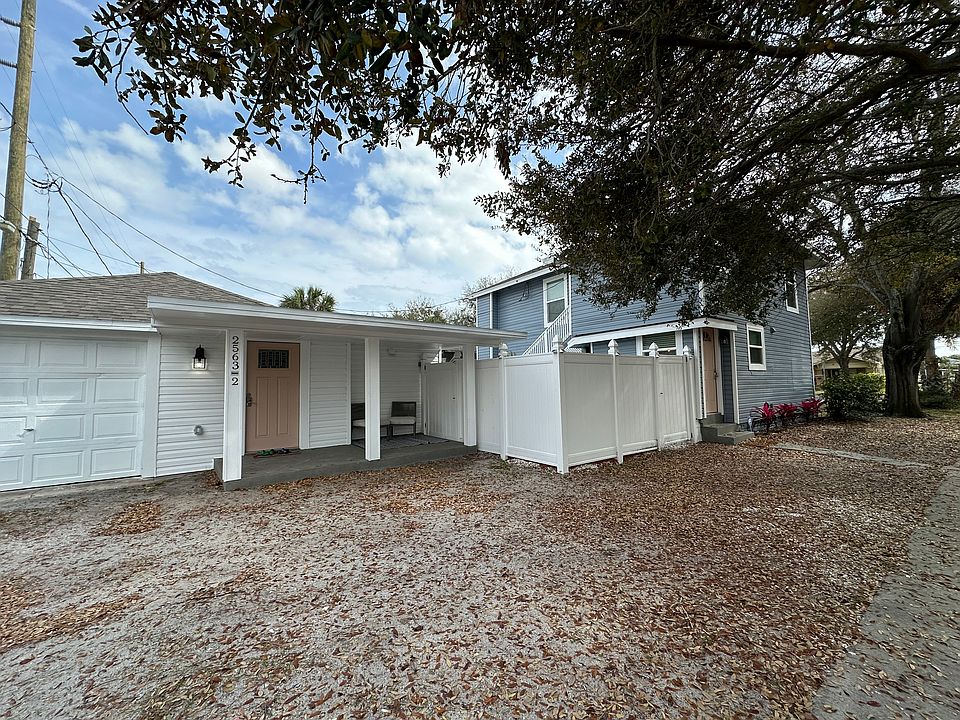 Main home, detached garage apartment (rented separately) and parking area for both dwellings