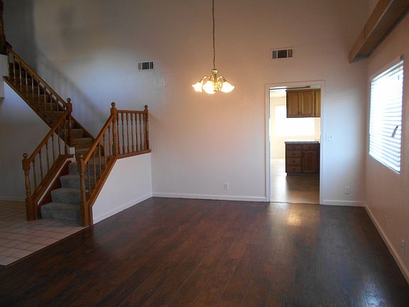 Spacious dining room featuring hardwood floors