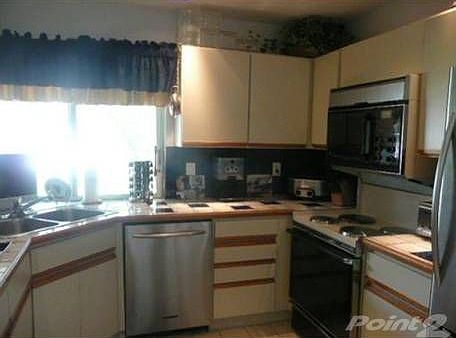 BRIGHT KITCHEN UPDATED WITH STAINLESS