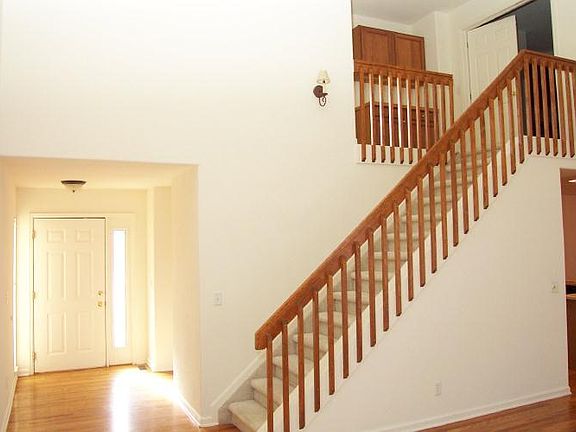 Front entryway and staircase leading to master bedroom/bathr