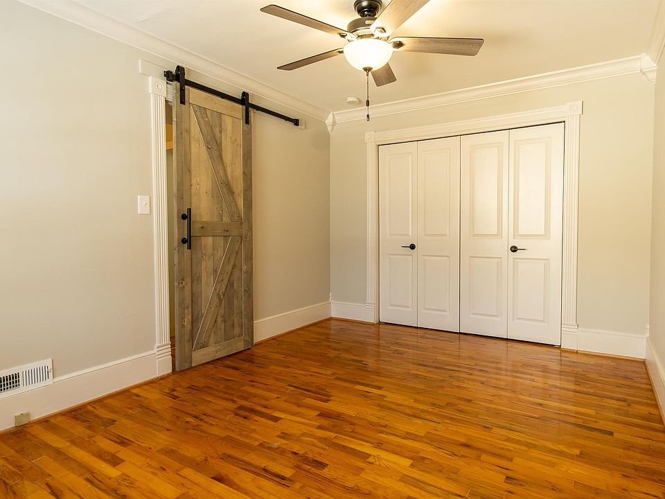 Large Bedroom with lots of light and sliding weathered pine barn door. Large Closet space.
