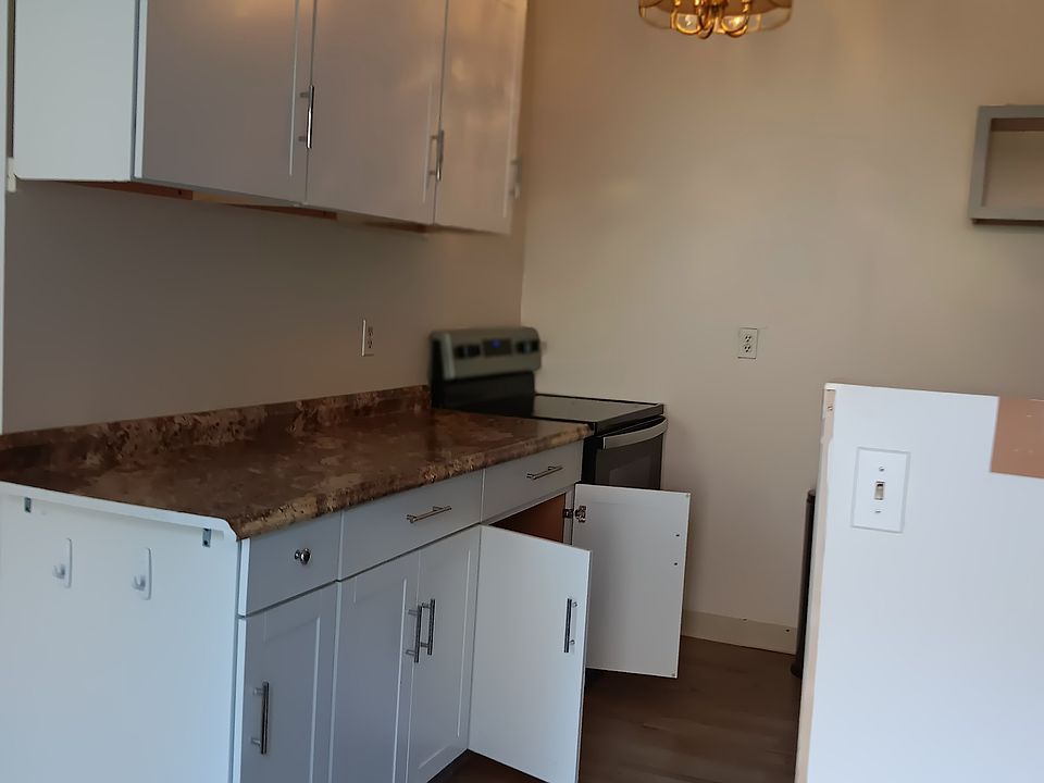 Kitchen with updated cabinets, electric stove