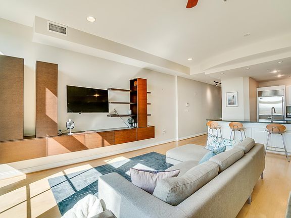 The half-bath is located around the corner from the kitchen at the top of the stairs that lead up from the private entrance.