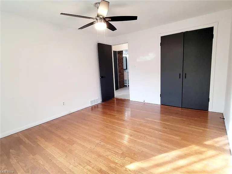 Master bedroom with brand new ceiling fan and good closet space.