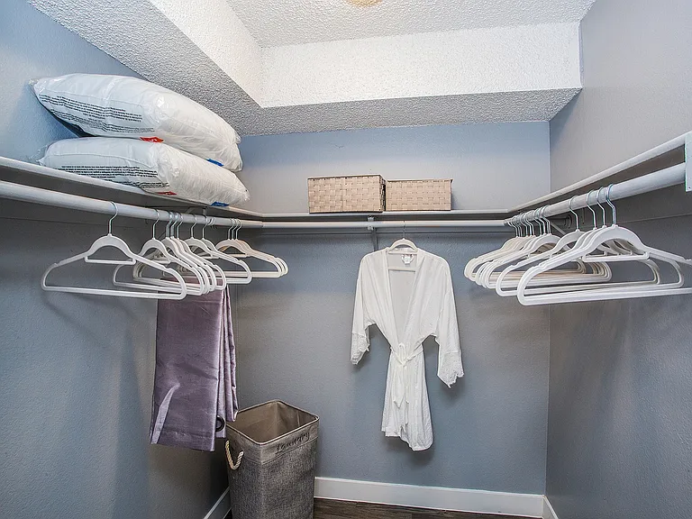 Explore this stylish walk-in closet, designed to elevate your storage solutions.