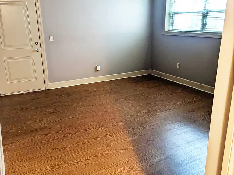 Unit entrance and livingroom at Auburn Apartments.