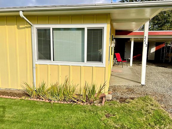 Gladiola flowers bloom every year and we maintain a nice grassy yard for our tenants.